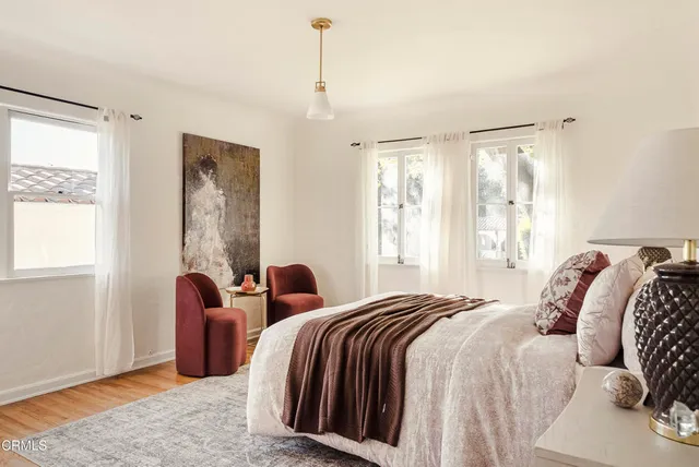 a bed room with a bed and a window