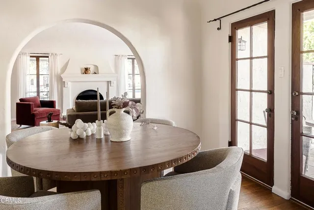 a view of a dining room with furniture window and wooden floor