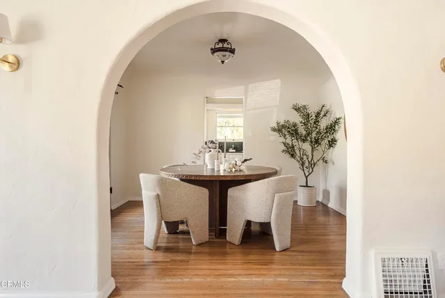 a dining room with furniture and window