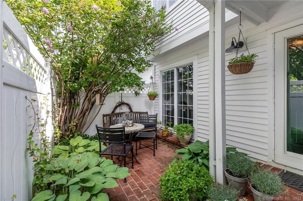 45 Quarry Ridge Road, Unit 45 Washington, CT 06777 - Photo 1 of 1 a backyard of a house with outdoor seating