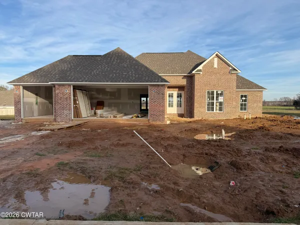 a front view of a house with yard