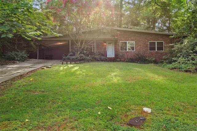 a backyard of a house with lots of green space