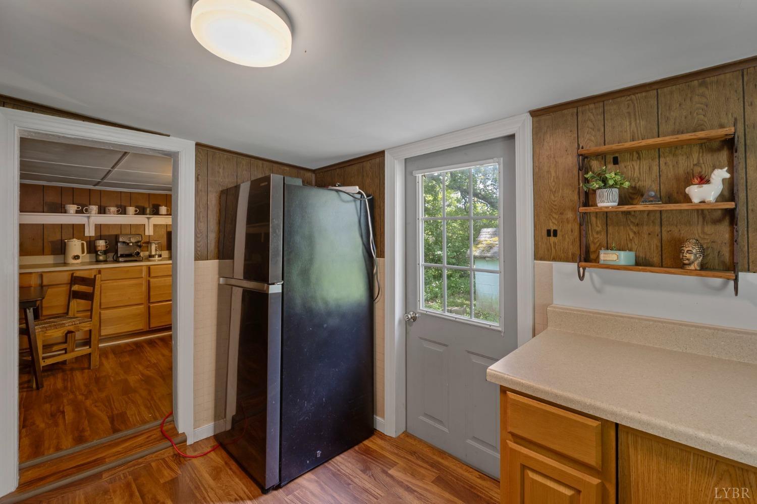 211 Shumaker Road Buckingham, VA 23921 - Photo 11 of 39 a kitchen with a refrigerator and countertop