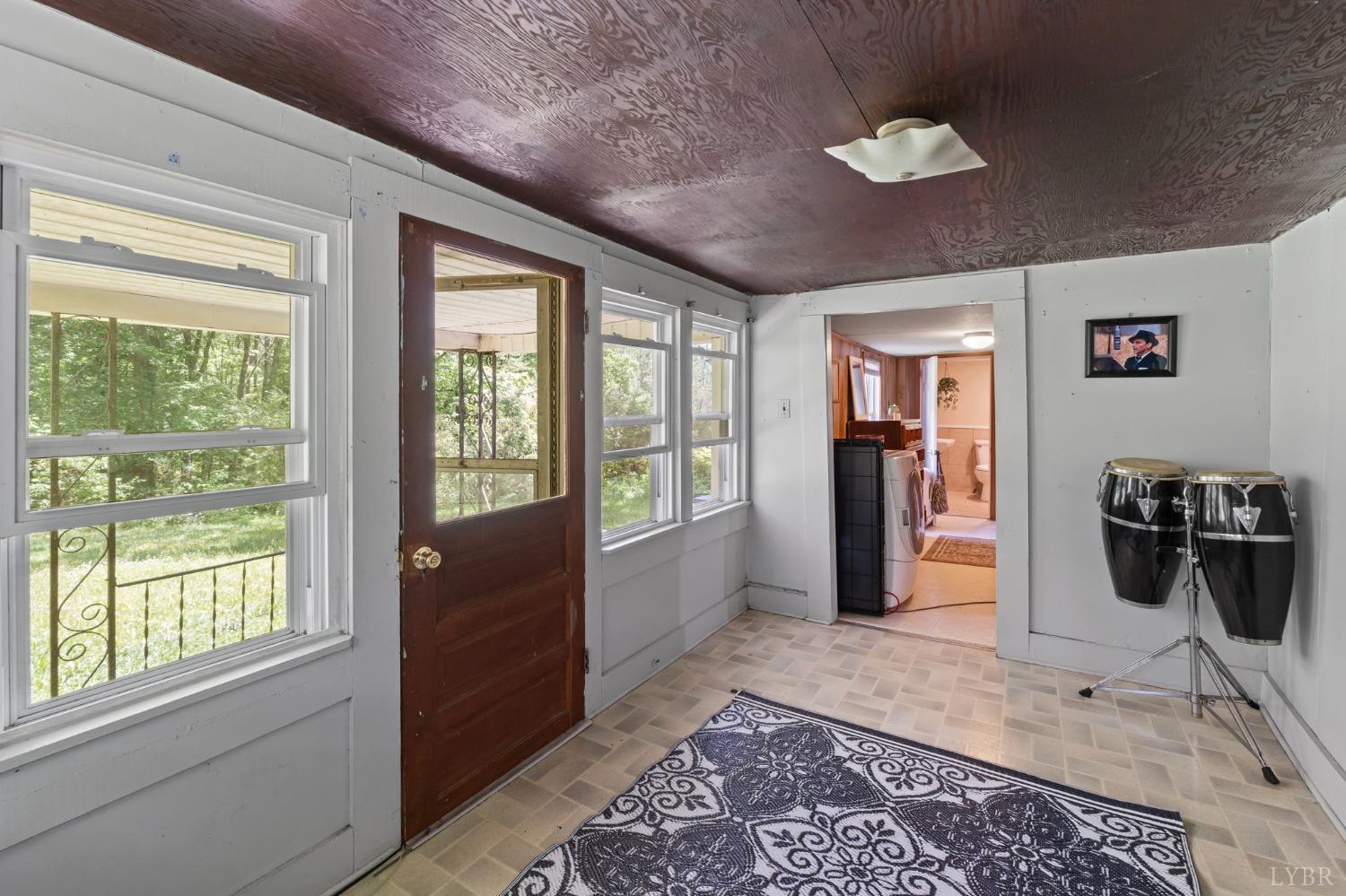 211 Shumaker Road Buckingham, VA 23921 - Photo 22 of 39 a living room with furniture and a large window