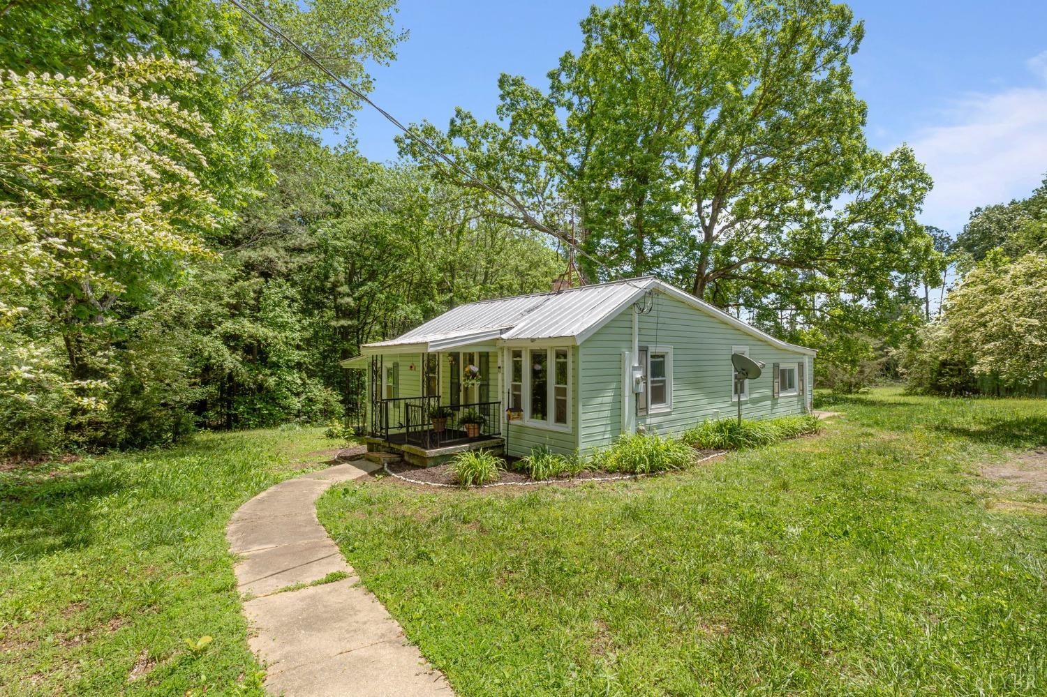 211 Shumaker Road Buckingham, VA 23921 - Photo 24 of 39 a front view of a house with a yard