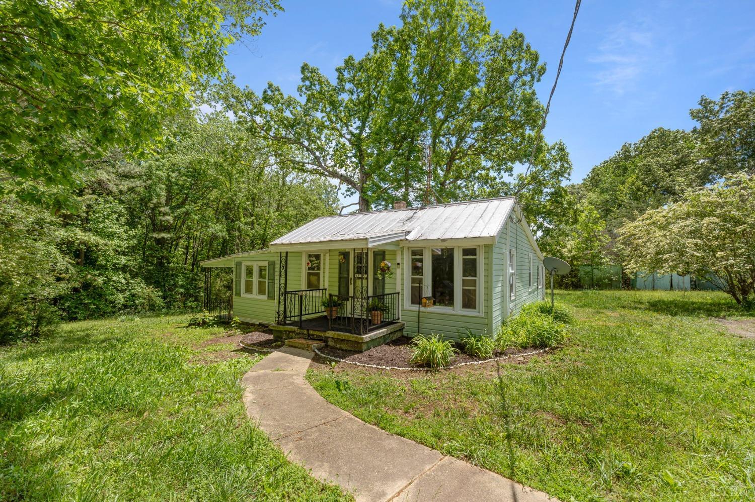 211 Shumaker Road Buckingham, VA 23921 - Photo 26 of 39 a backyard of a house with yard and outdoor seating