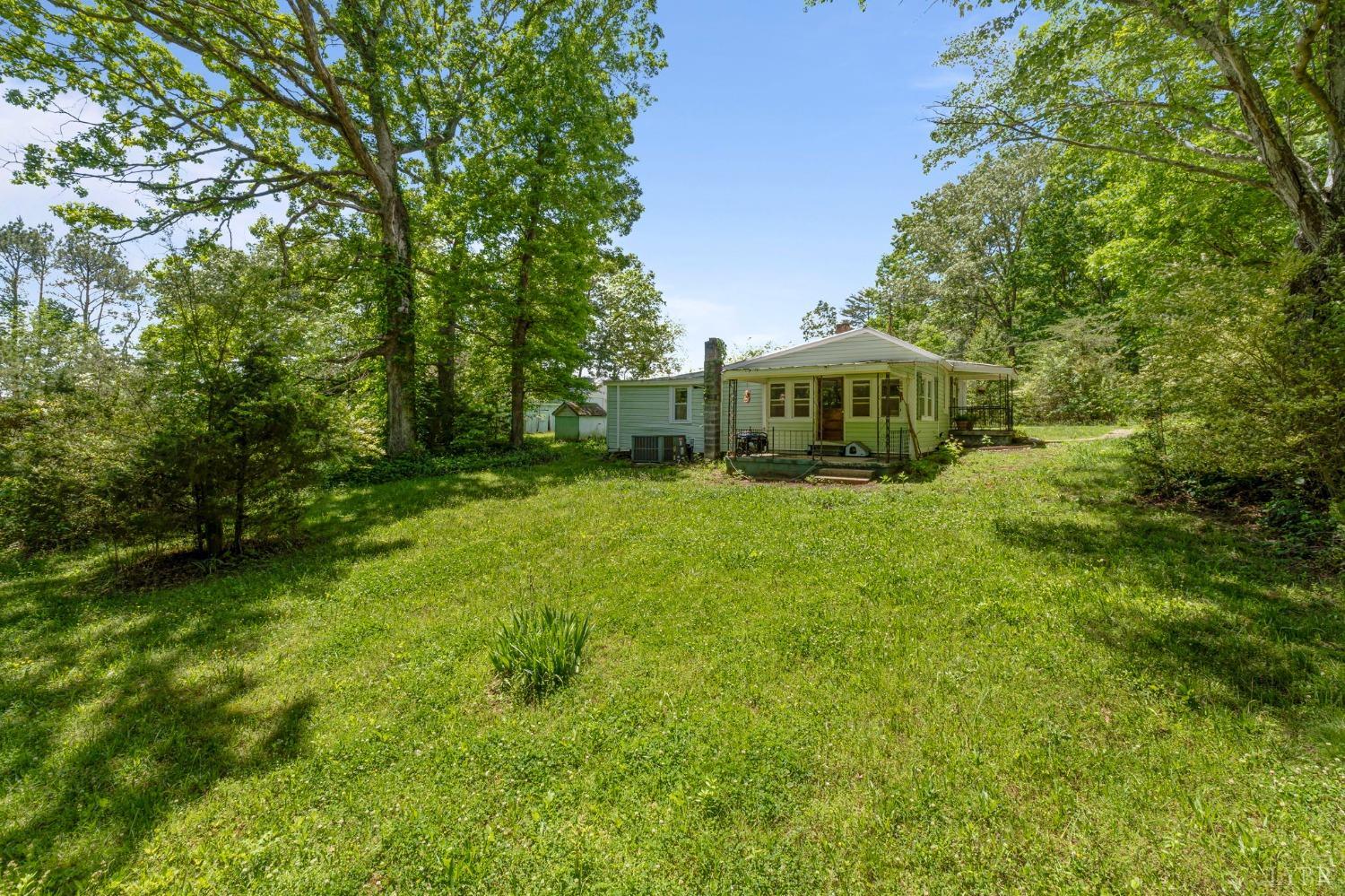 211 Shumaker Road Buckingham, VA 23921 - Photo 29 of 39 a front view of a house with a big yard