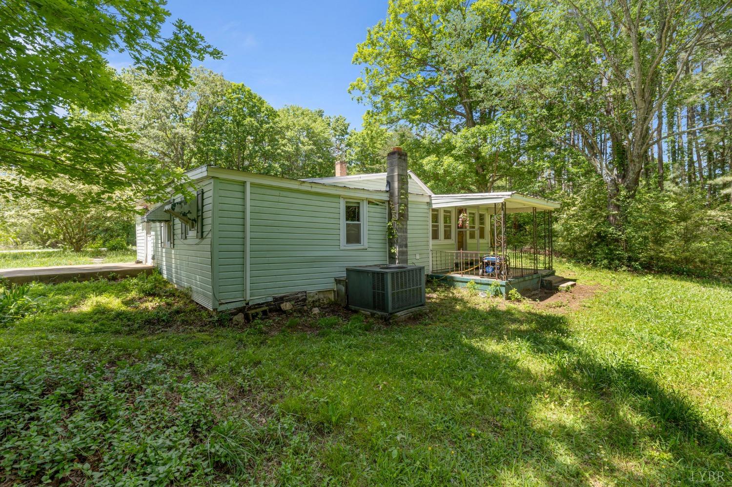 211 Shumaker Road Buckingham, VA 23921 - Photo 31 of 39 a view of a house with backyard