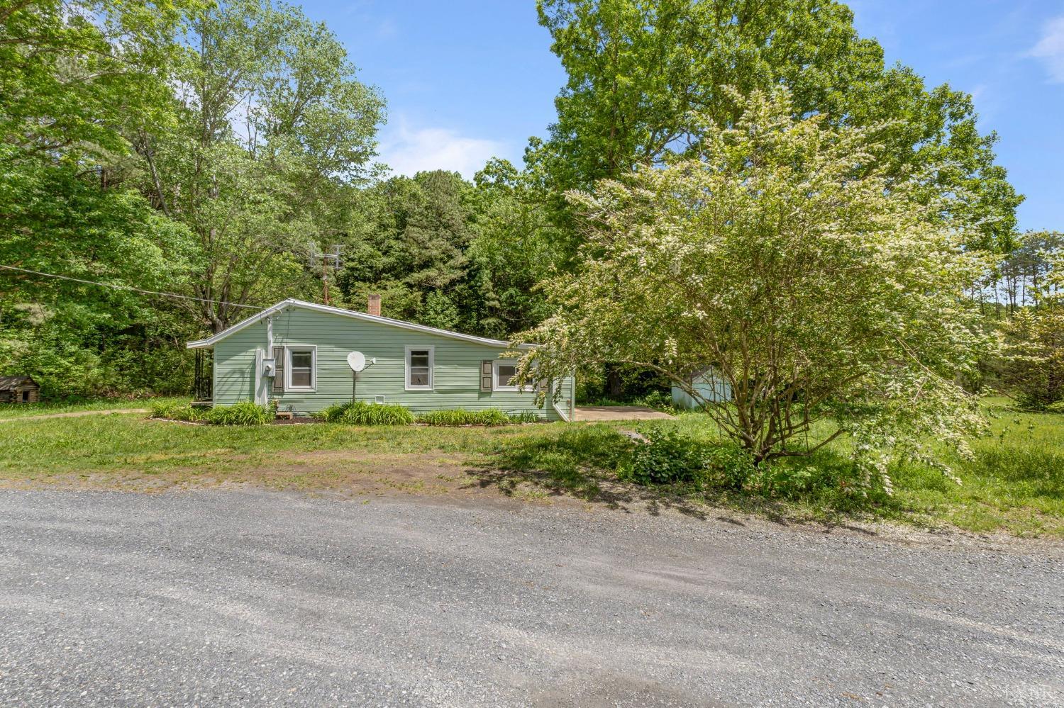 211 Shumaker Road Buckingham, VA 23921 - Photo 39 of 39 a front view of a house with a yard and garage