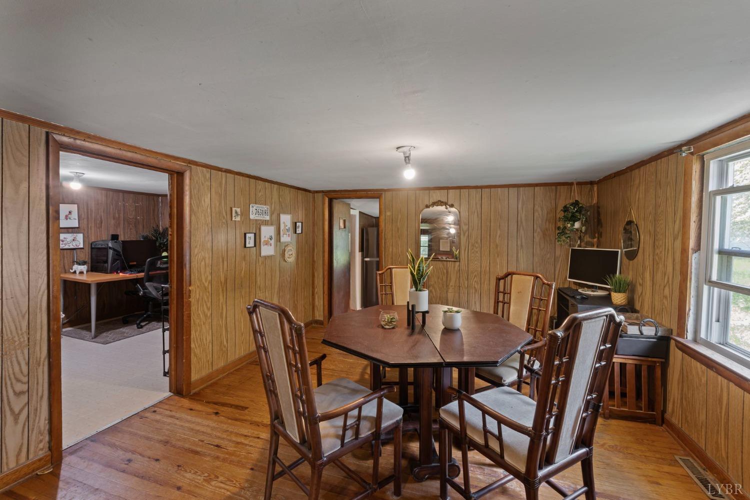 211 Shumaker Road Buckingham, VA 23921 - Photo 8 of 39 a view of a dining room with furniture window and wooden floor