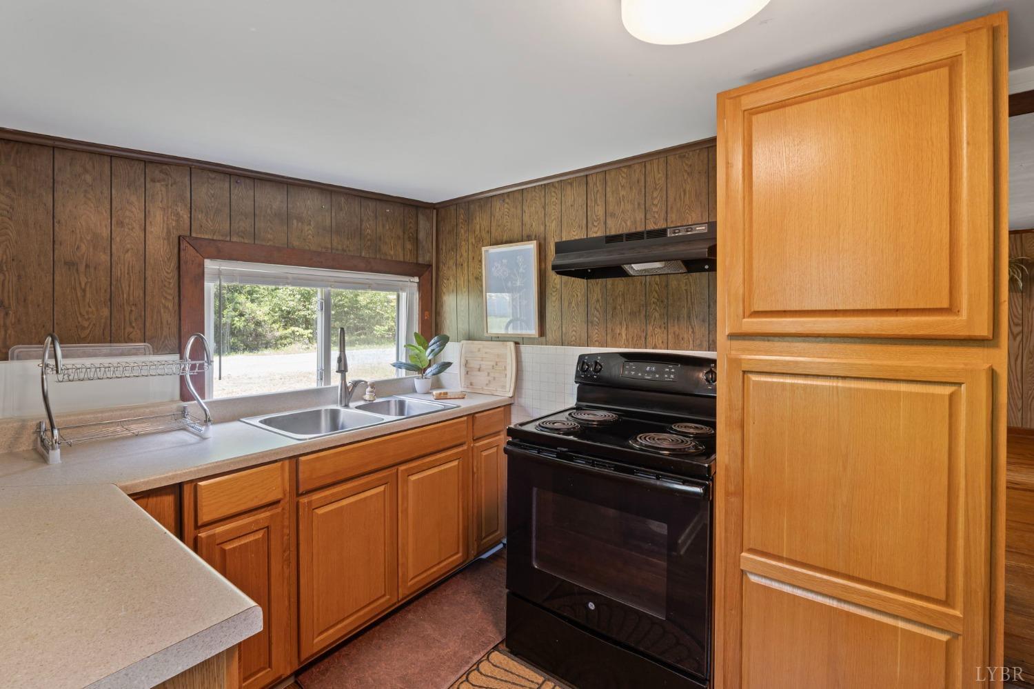 211 Shumaker Road Buckingham, VA 23921 - Photo 10 of 39 a kitchen with a sink and a refrigerator
