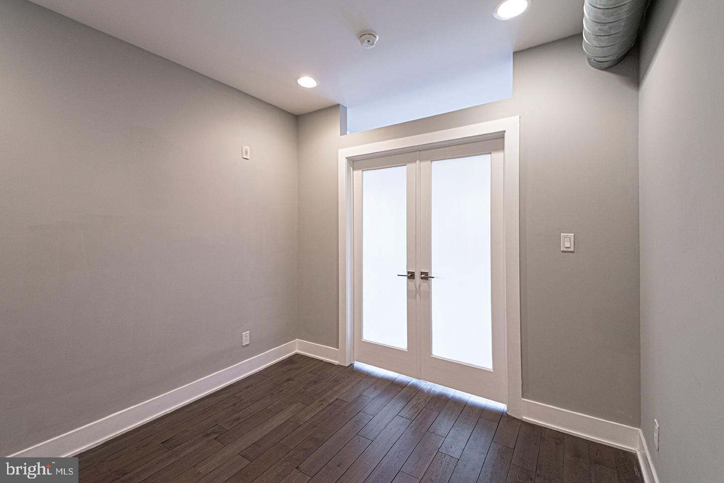 135 North 3rd Street, Unit 3D Philadelphia, PA 19106 - Photo 11 of 20 a view of an empty room with wooden floor