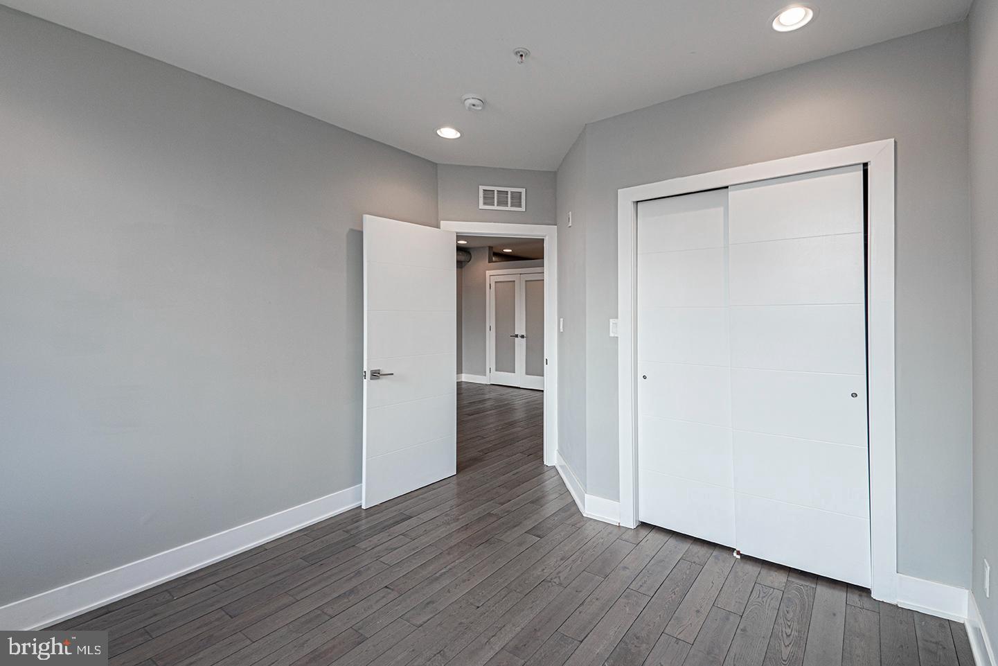 135 North 3rd Street, Unit 3D Philadelphia, PA 19106 - Photo 14 of 20 a view of a hallway with wooden floor and closet area