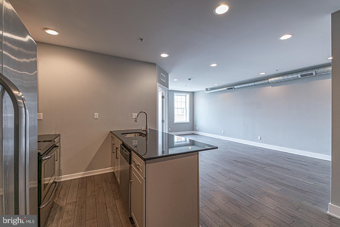 135 North 3rd Street, Unit 3D Philadelphia, PA 19106 - Photo 2 of 20 a view of a room with wooden floor and staircase