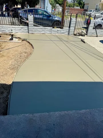 a living room with large windows and a table