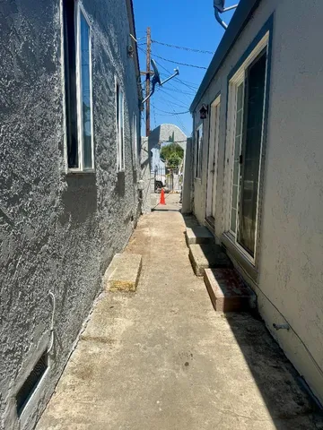 a view of a bathroom with a sink and a mirror