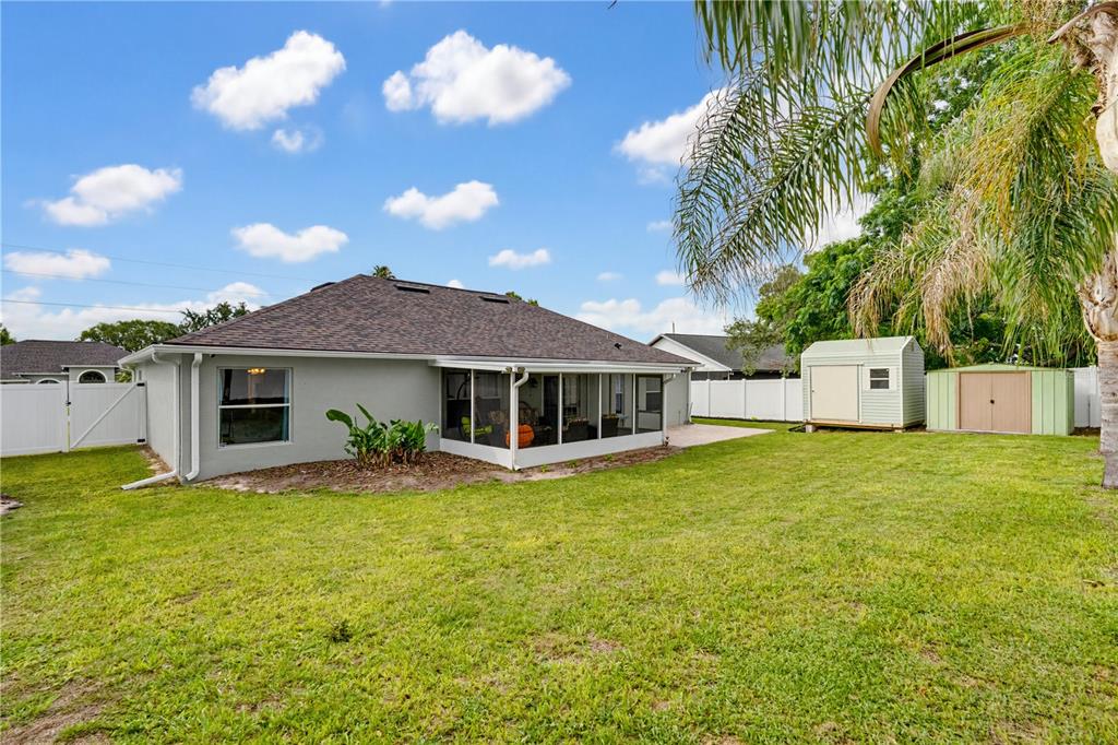 3497 Chadwick Avenue Spring Hill, FL 34609 - Photo 37 of 47 a view of a house with a yard