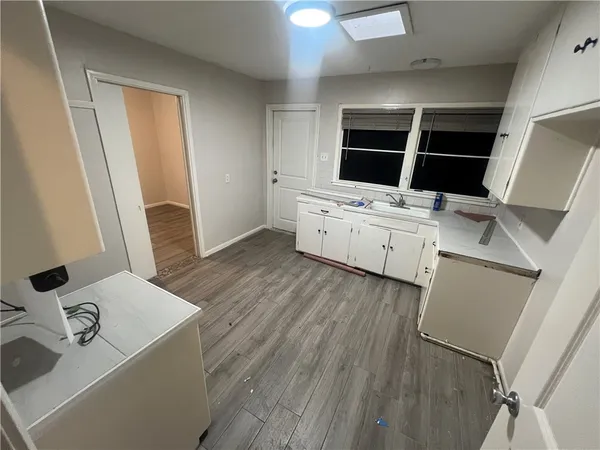 a room with furniture and flat screen tv