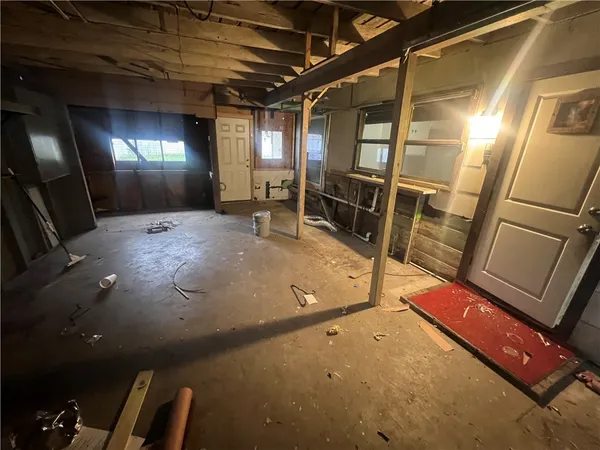 a view of an empty room with windows