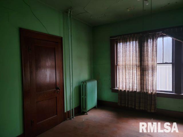 101 South 6th Street Murphysboro, IL 62966 - Photo 12 of 42 an empty room with a window and a fireplace