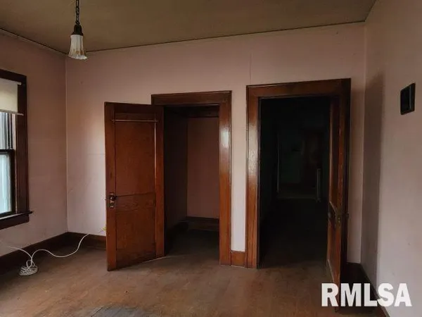 an empty room with closet