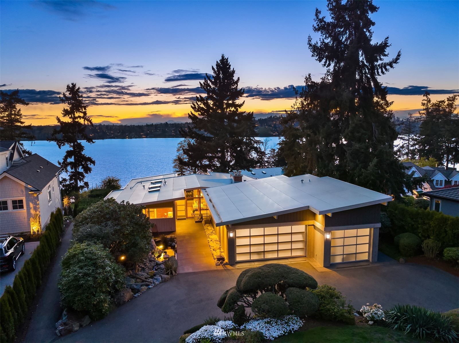 a view of a house with a swimming pool and a yard