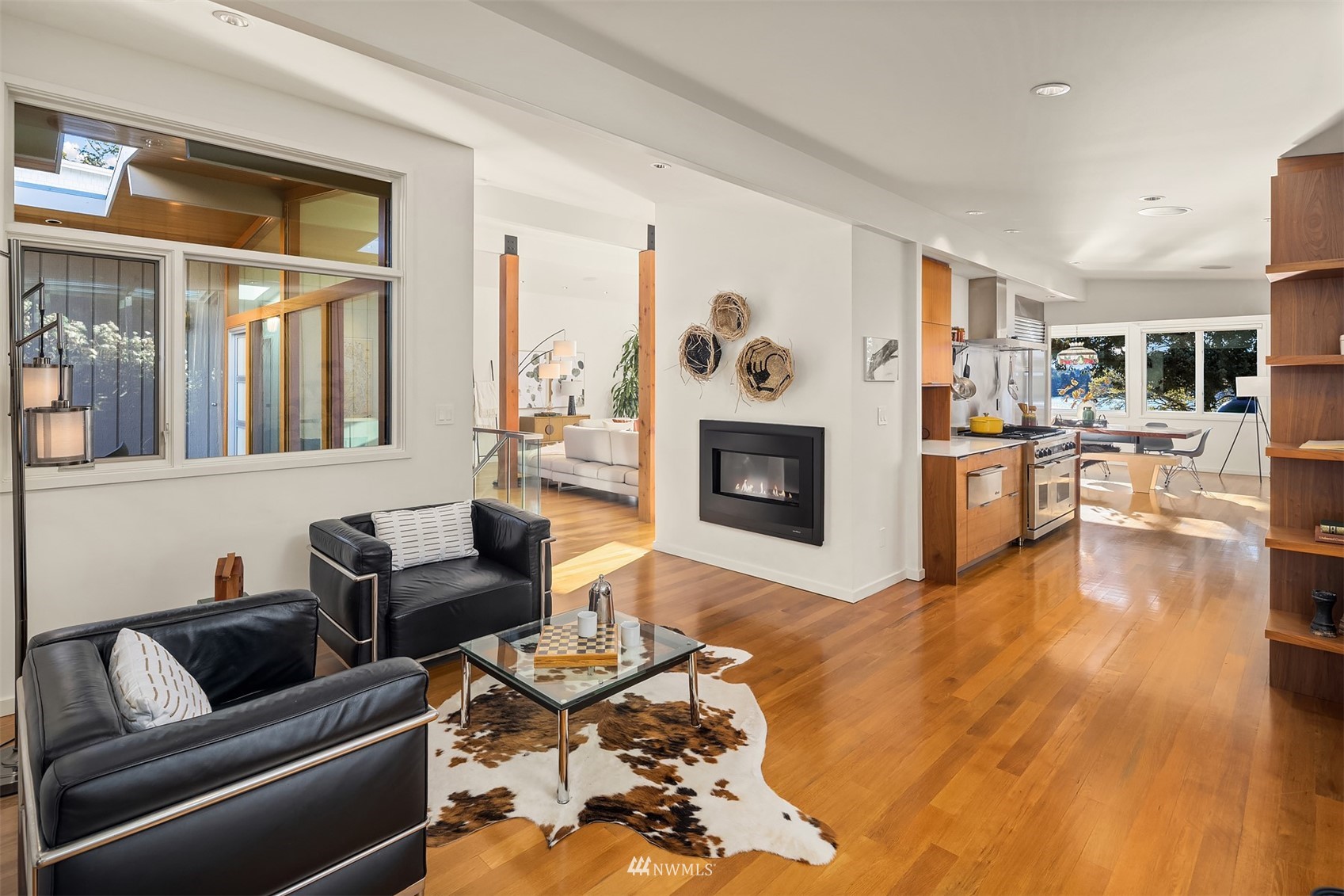 7255 West Ridge Road Mercer Island, WA 98040 - Photo 15 of 40 a living room with furniture and a fireplace