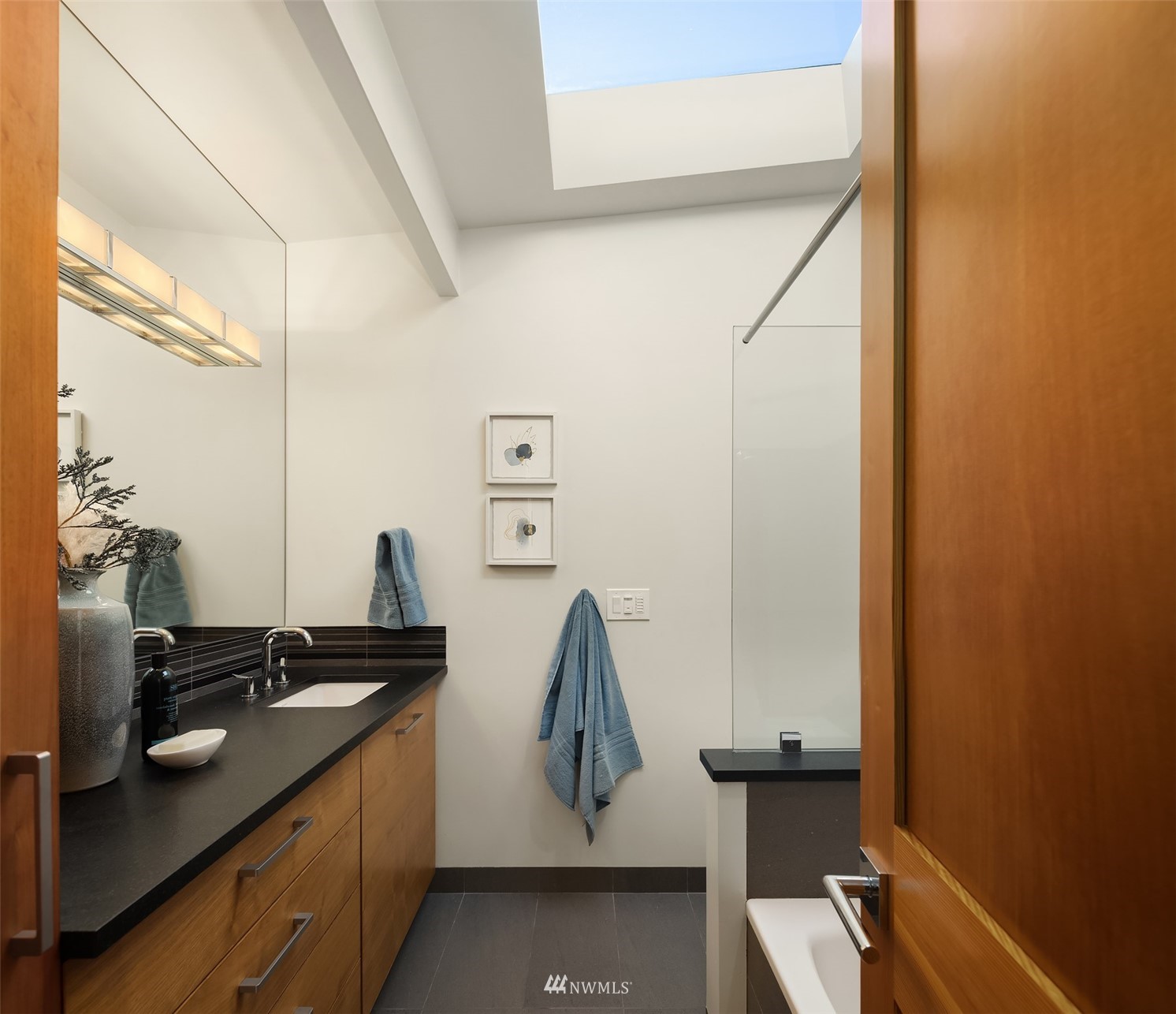 7255 West Ridge Road Mercer Island, WA 98040 - Photo 20 of 40 a bathroom with a sink and a mirror