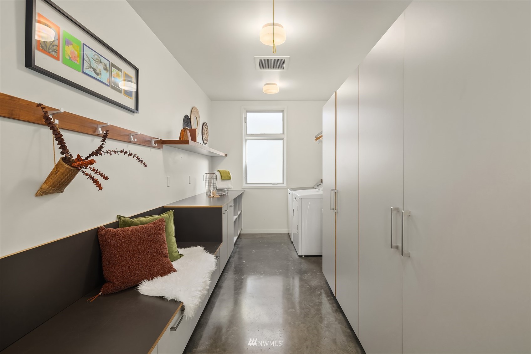 7255 West Ridge Road Mercer Island, WA 98040 - Photo 23 of 40 a view of a hallway with wooden floor and staircase