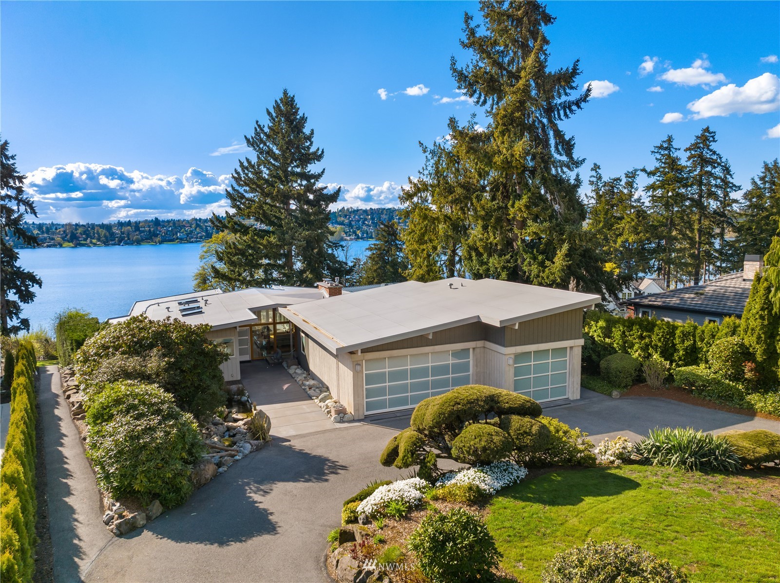 7255 West Ridge Road Mercer Island, WA 98040 - Photo 35 of 40 a aerial view of a house with a yard and lake view