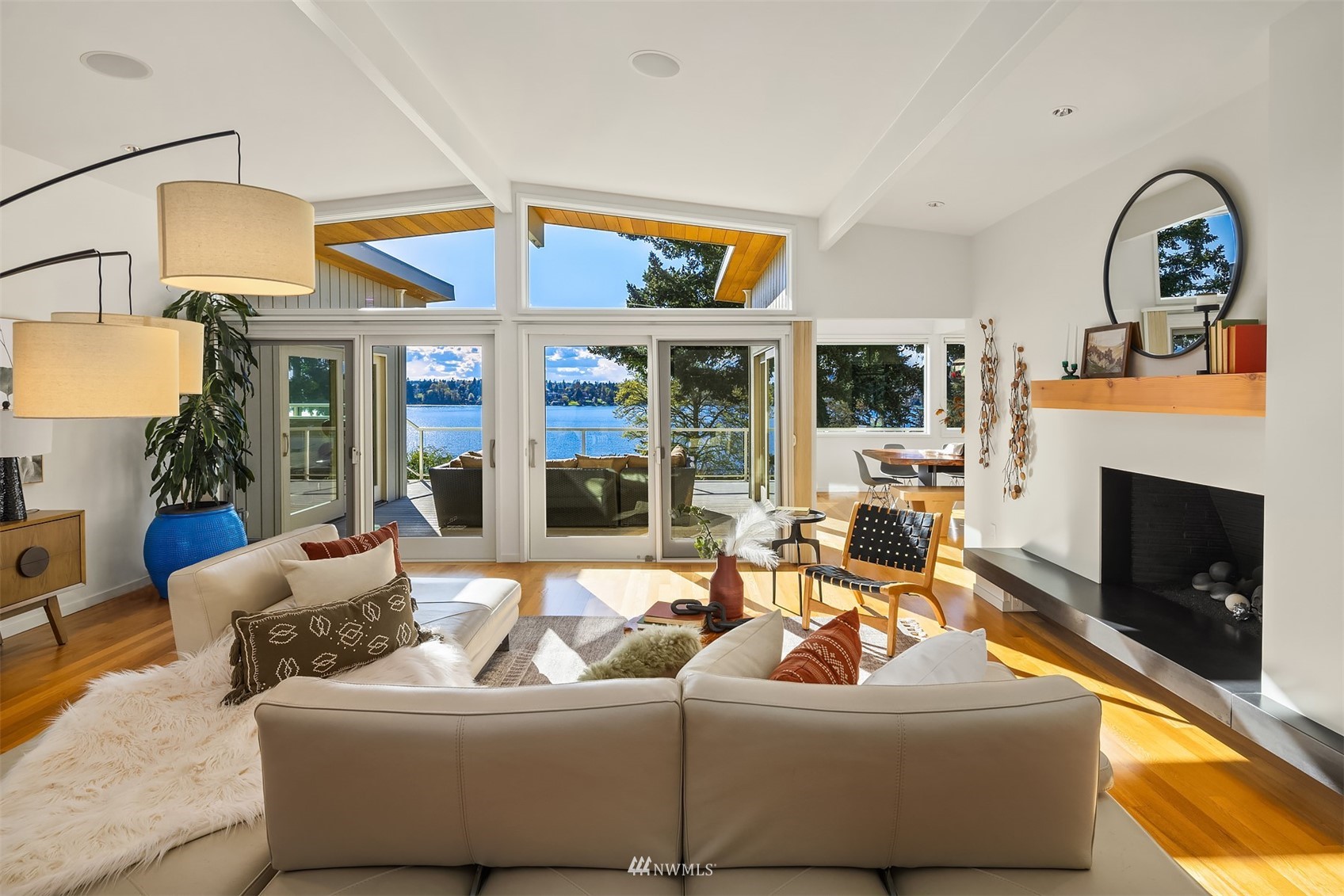 7255 West Ridge Road Mercer Island, WA 98040 - Photo 6 of 40 a living room with furniture fireplace and a flat screen tv