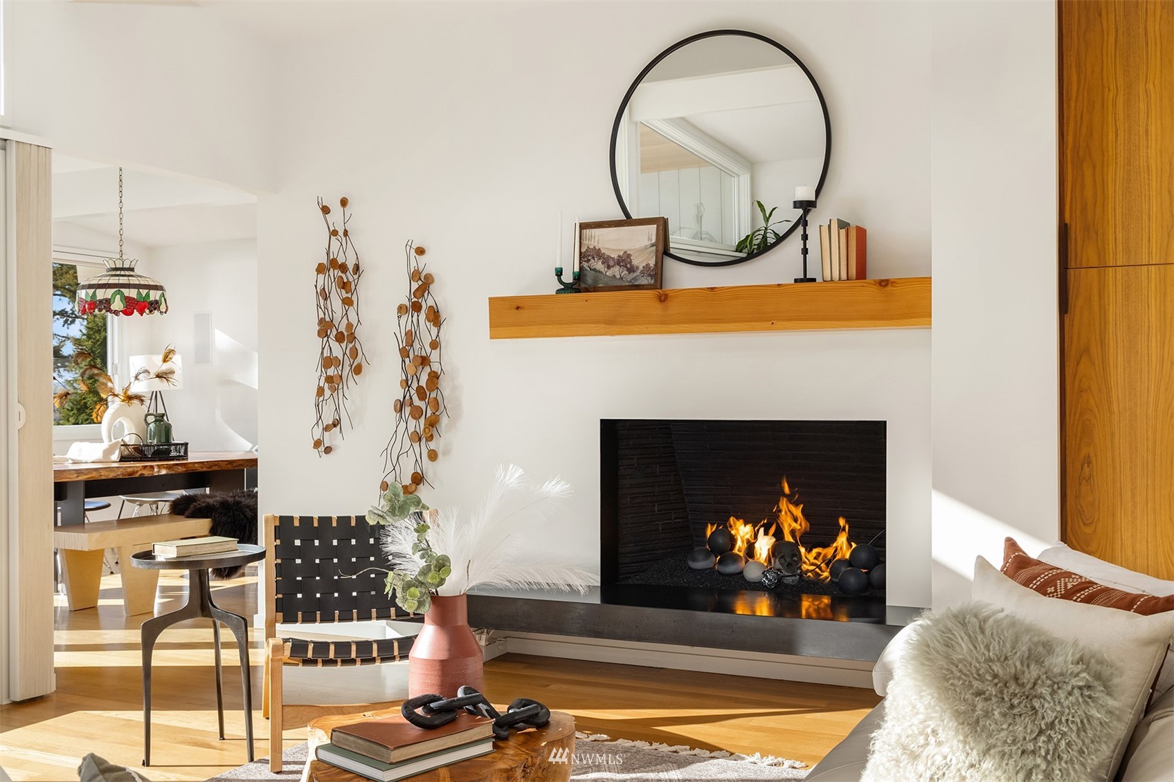 7255 West Ridge Road Mercer Island, WA 98040 - Photo 7 of 40 a living room with a fireplace and a chandelier