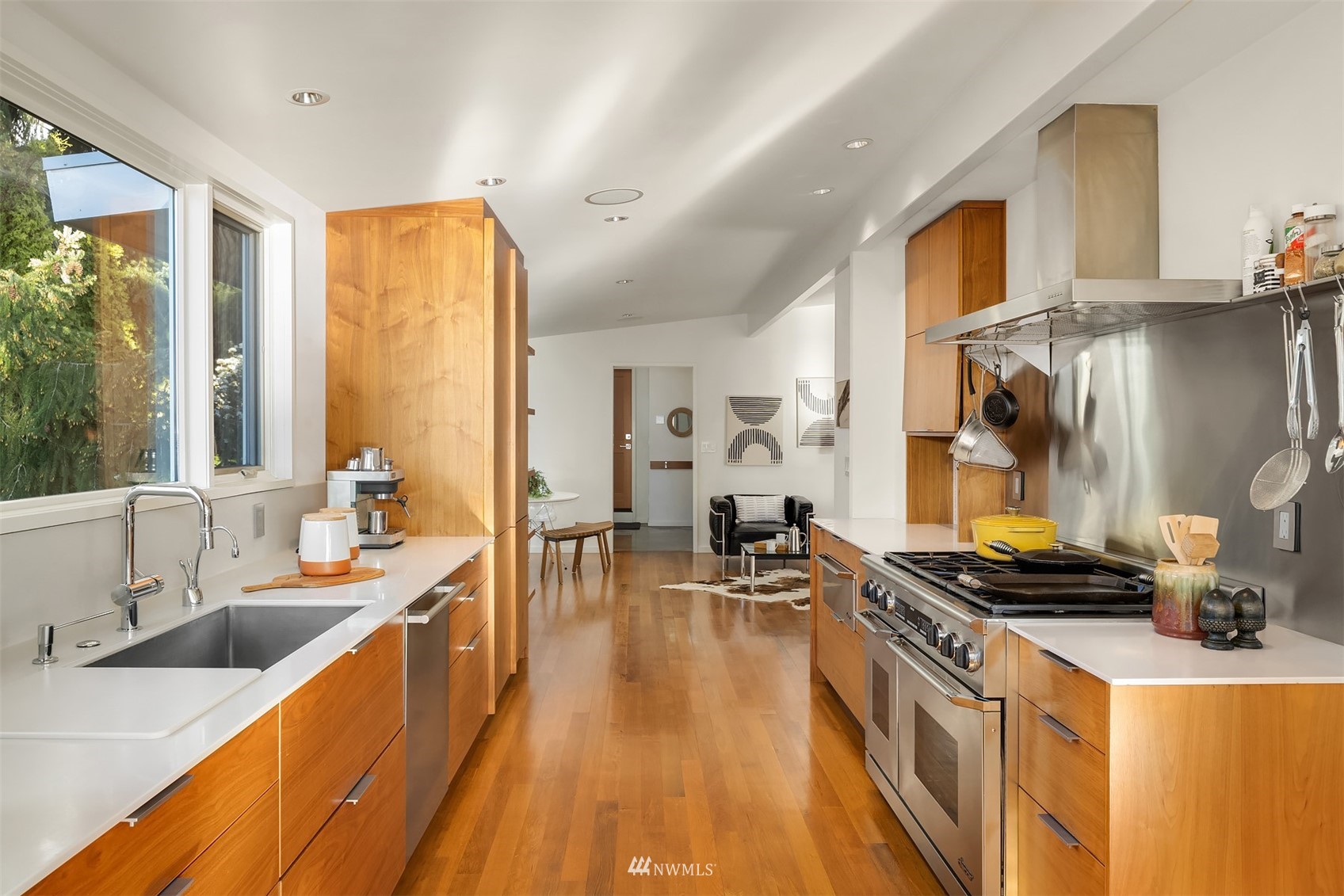 7255 West Ridge Road Mercer Island, WA 98040 - Photo 9 of 40 a large kitchen with stainless steel appliances a stove a sink a refrigerator and cabinets