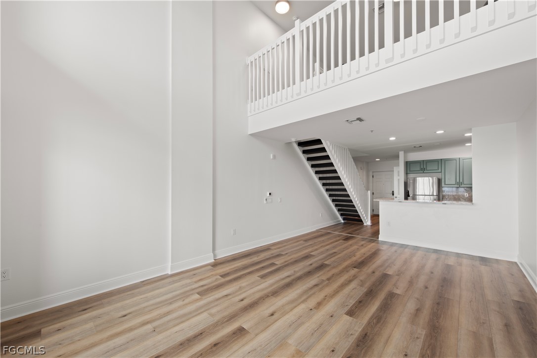 2745 First Street, Unit 113 Fort Myers, FL 33916 - Photo 11 of 35 a view of an empty room with wooden floor