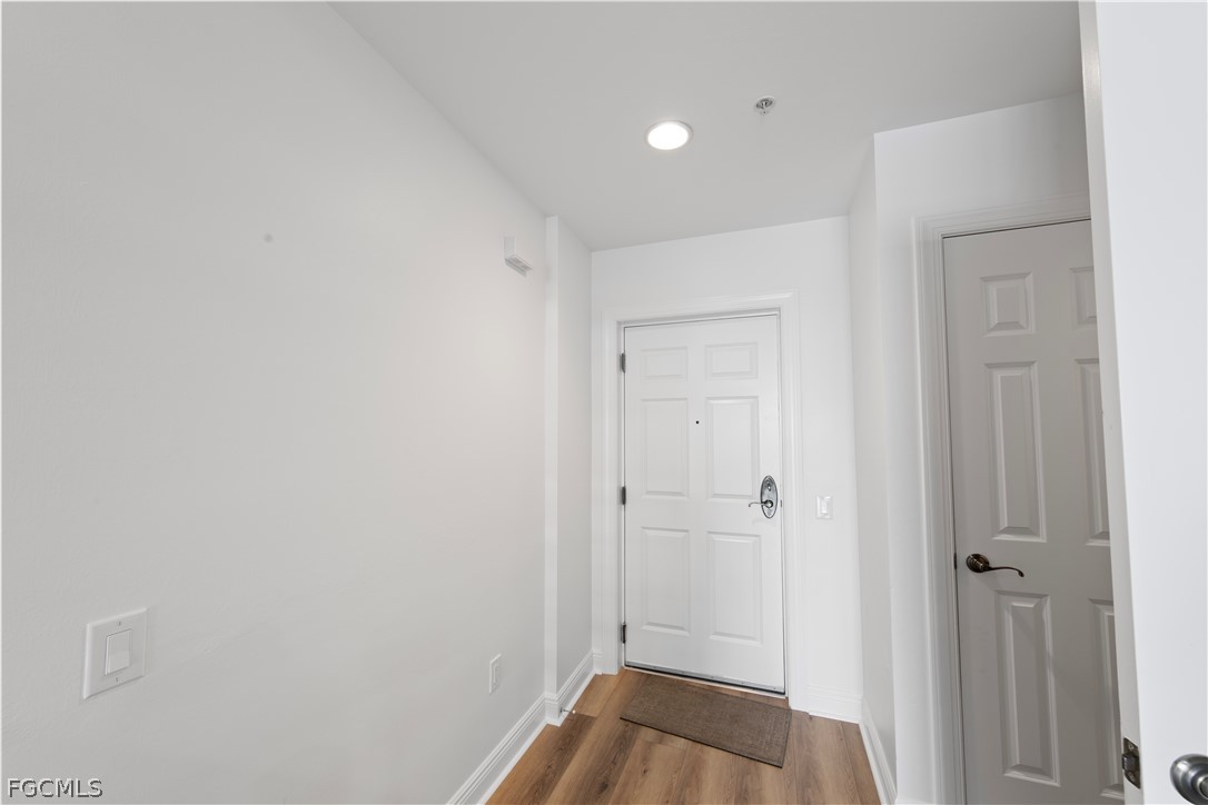 2745 First Street, Unit 113 Fort Myers, FL 33916 - Photo 13 of 35 a view of a hallway with wooden floor