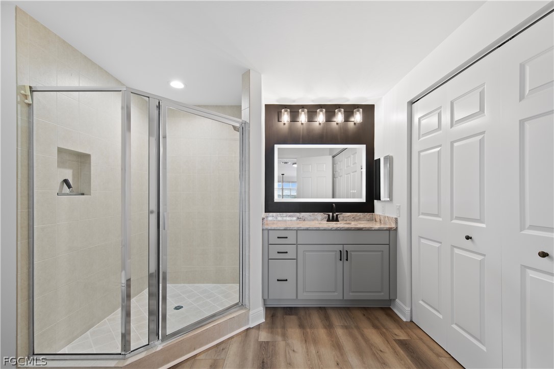 2745 First Street, Unit 113 Fort Myers, FL 33916 - Photo 18 of 35 a bathroom with a double vanity sink mirror and shower