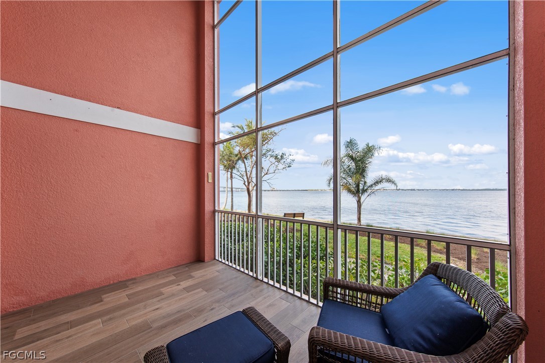 2745 First Street, Unit 113 Fort Myers, FL 33916 - Photo 2 of 35 a view of a porch with a floor to ceiling window