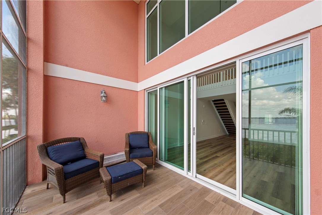 2745 First Street, Unit 113 Fort Myers, FL 33916 - Photo 21 of 35 a balcony with furniture and a potted plant