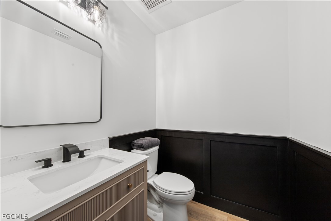 2745 First Street, Unit 113 Fort Myers, FL 33916 - Photo 3 of 35 a bathroom with a sink and a toilet