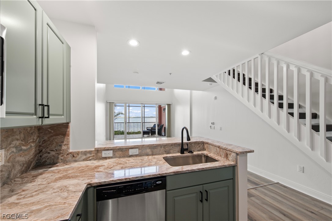2745 First Street, Unit 113 Fort Myers, FL 33916 - Photo 6 of 35 a kitchen with sink and window