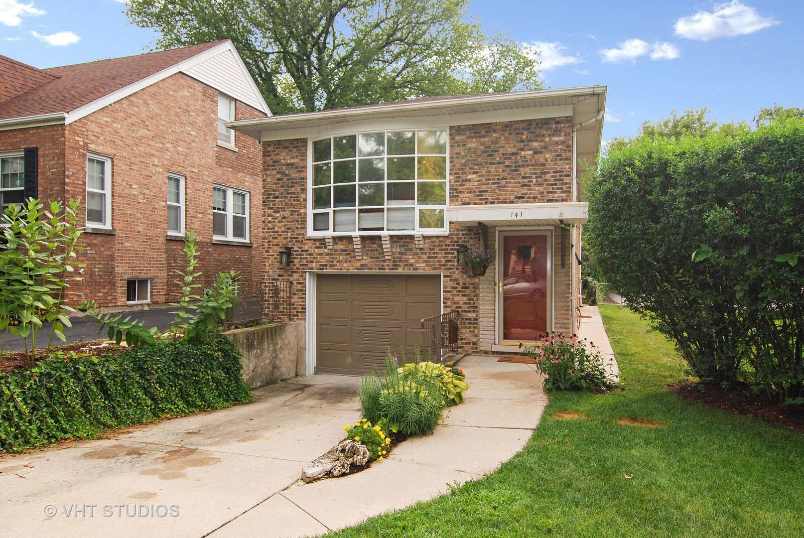 141 Barrypoint Road Riverside, IL 60546 - Photo 1 of 19 front view of a house with a yard