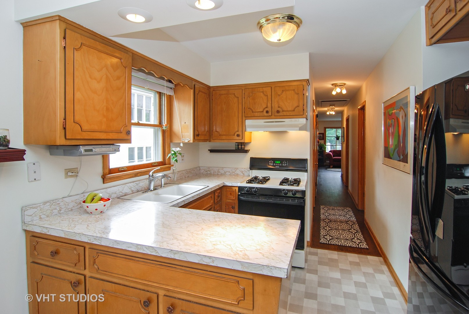 141 Barrypoint Road Riverside, IL 60546 - Photo 4 of 19 a kitchen with stainless steel appliances granite countertop a sink stove and refrigerator