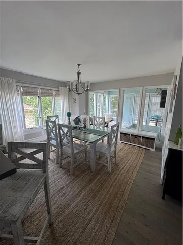 a bedroom with a bed chair and a window