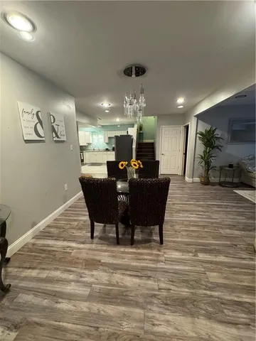 a bedroom with a bed and a ceiling fan