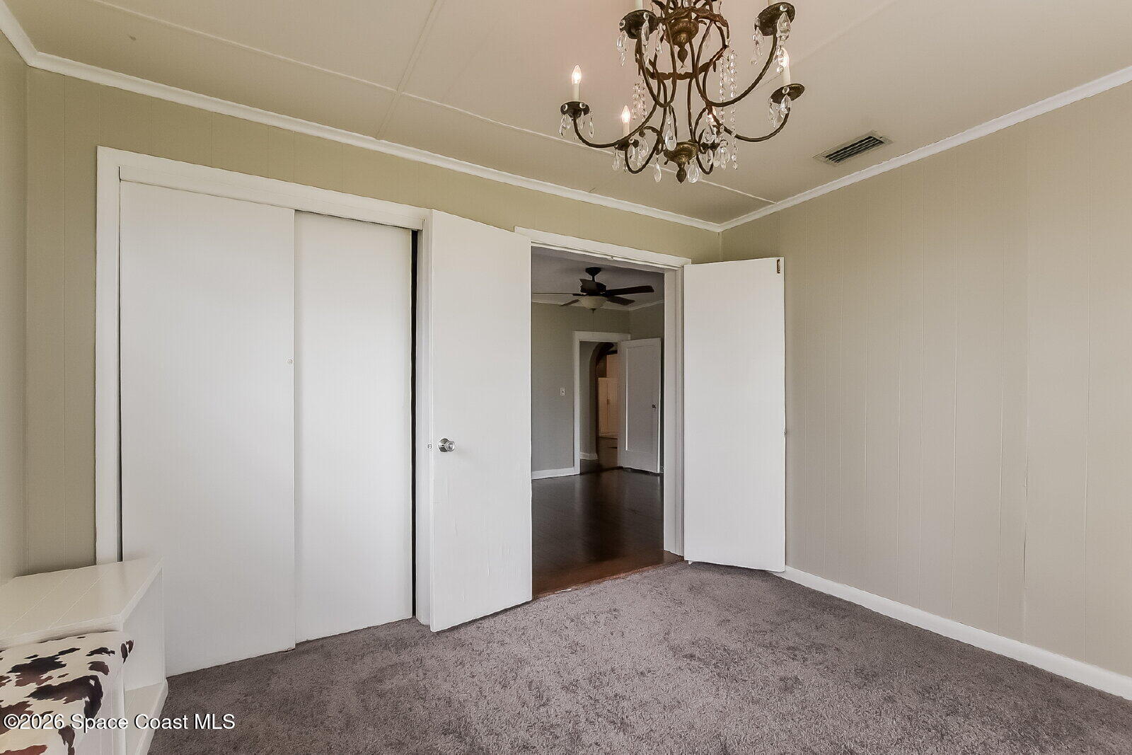 1428 Riverside Drive Titusville, FL 32780 - Photo 9 of 17 a view of a hallway with a chandelier