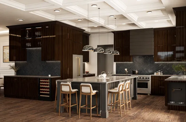 a kitchen with stainless steel appliances kitchen island granite countertop a table chairs and a refrigerator