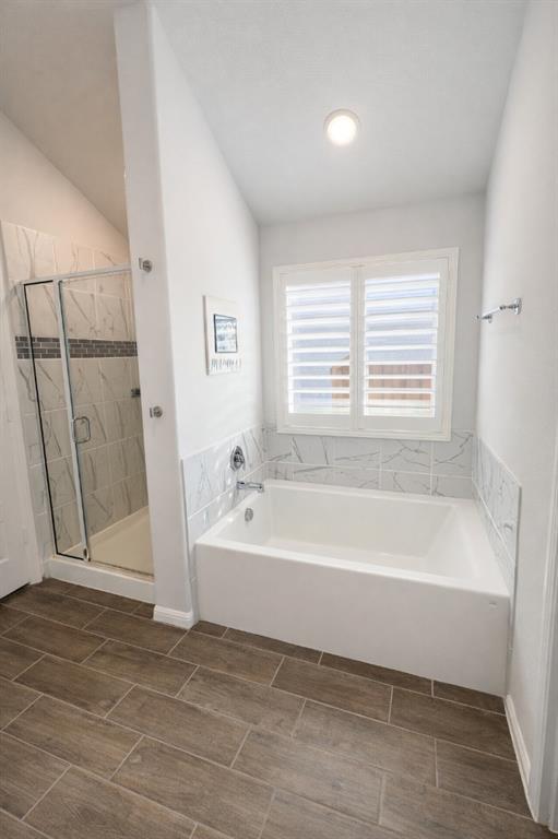 6609 Adderly Road Pilot Point, TX 76258 - Photo 8 of 15 a spacious bathroom with a bathtub and a shower