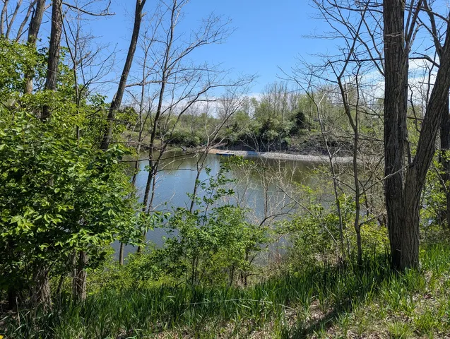 front view of a house with a lake view