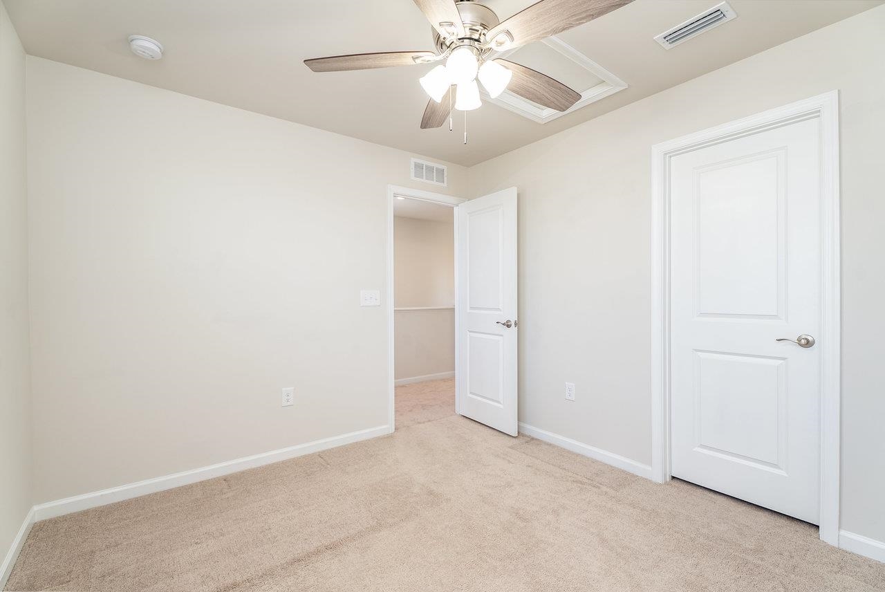 1207 Watson Lane Grottoes, VA 24441 - Photo 34 of 75 an empty room with a chandelier fan and closet area