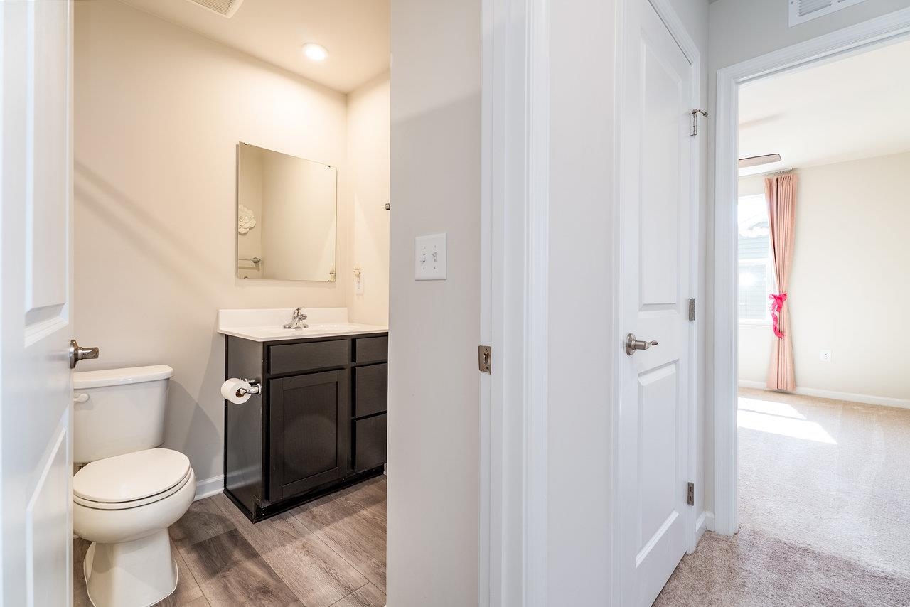 1207 Watson Lane Grottoes, VA 24441 - Photo 39 of 75 a bathroom with a toilet a sink and a mirror